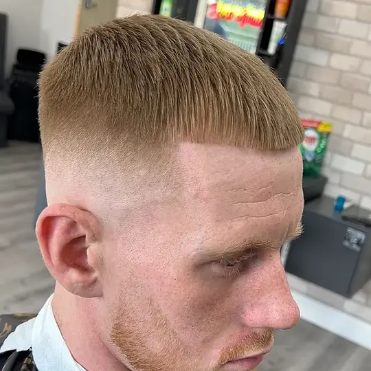 After cut by AJ — sharp blunt-fringe fade