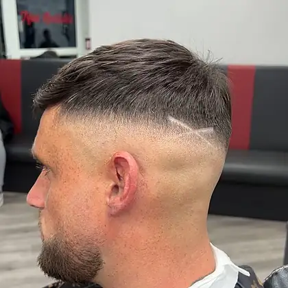 Zero fade with sharp temple lineup — barber van Leeds