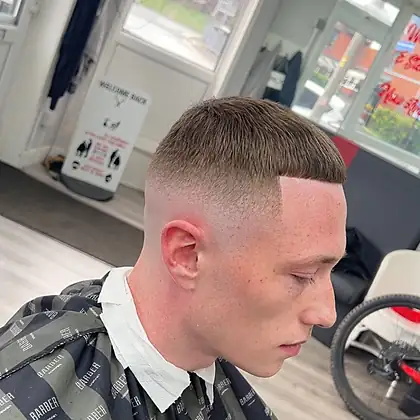 High skin fade with beard sculpt — premium grooming Leeds